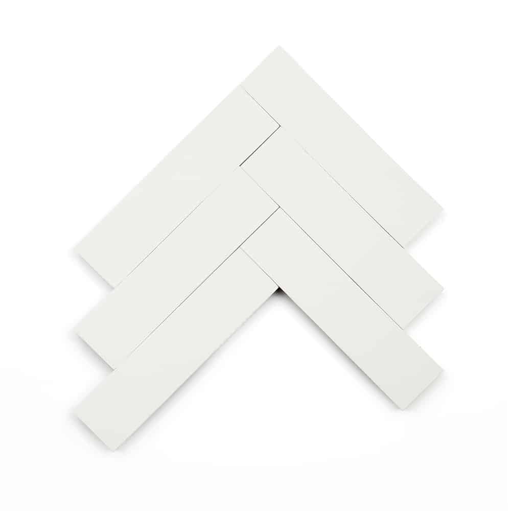 Six White 2x8, Sample tiles by vendor-unknown are arranged in a herringbone pattern on a white background, creating a V-shaped design with alternating directions.