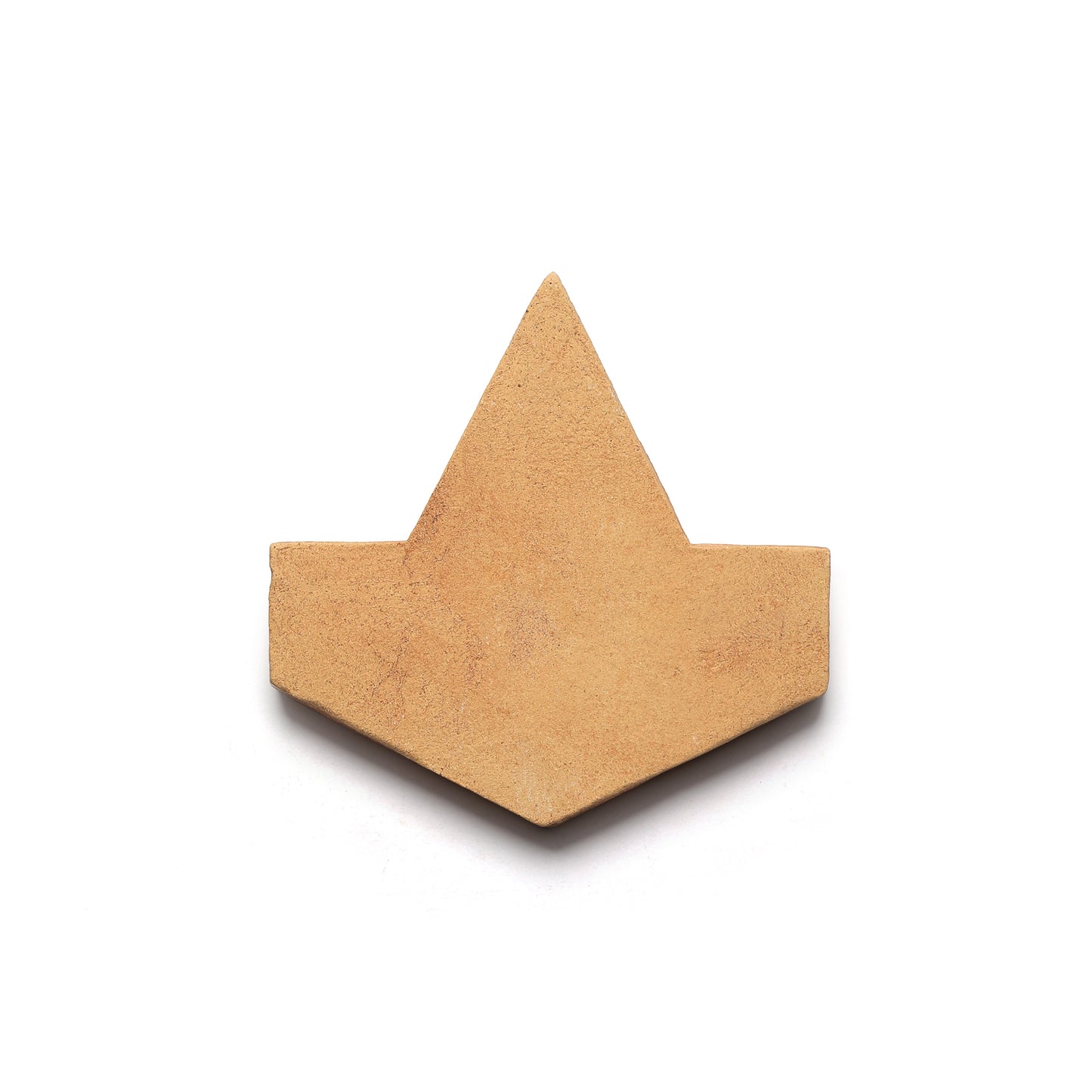 The Alcazar + Adobe tile by Zia Tile features a tan, geometric Cotto clay design with a triangular peak, evoking artisanal San Miguel de Allende charm against a white backdrop.