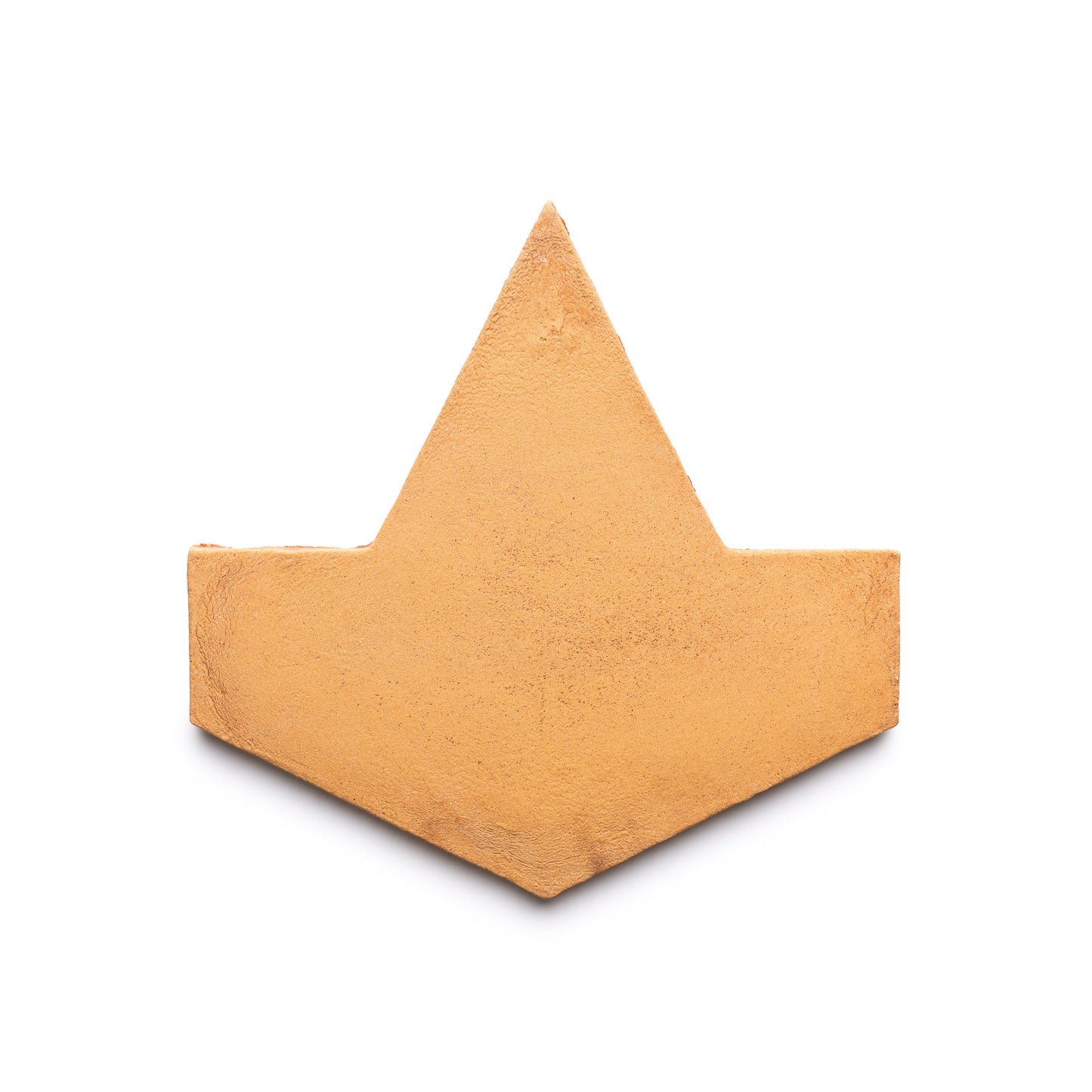 A flat, golden-yellow geometric shape resembling a stylized crown or arrowhead from Zia Tile’s Big Alcazar + Adobe, Sample is displayed against a plain white background.