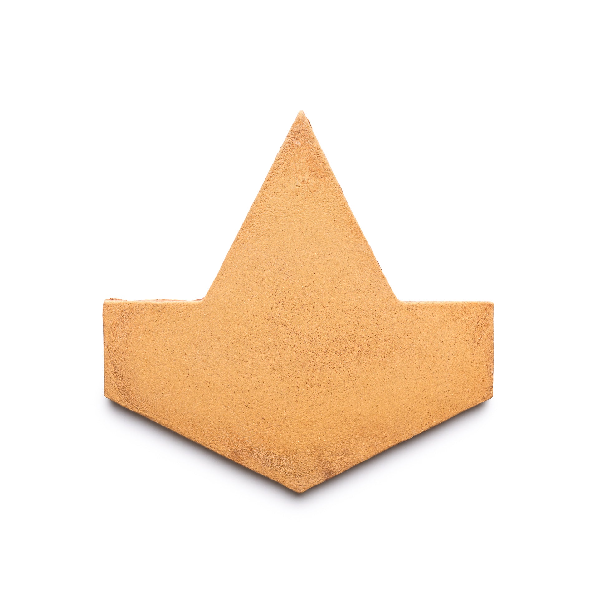 A flat, golden-yellow geometric shape resembling a stylized crown or arrowhead from Zia Tile’s Big Alcazar + Adobe, Sample is displayed against a plain white background.