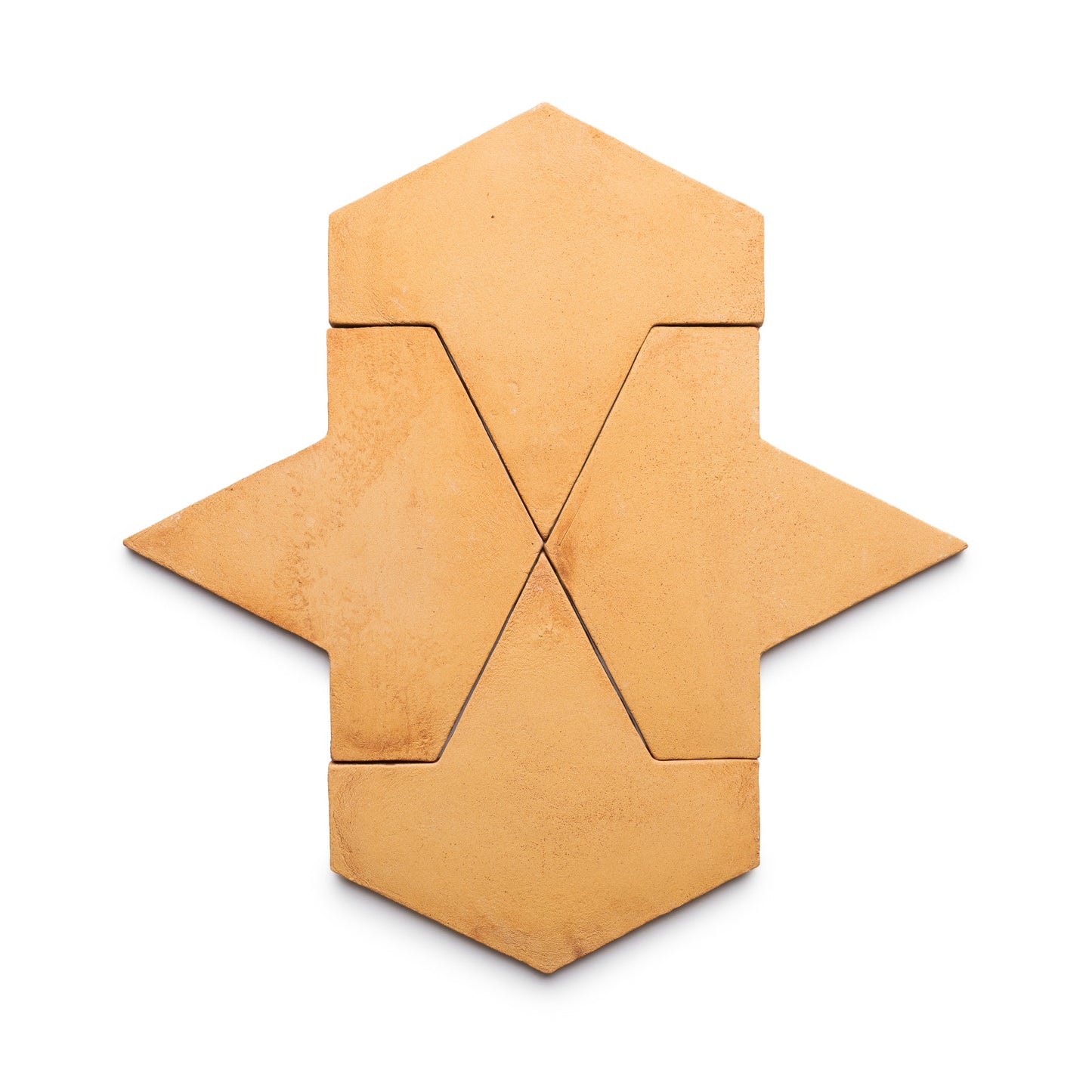 Four Big Alcazar + Adobe tiles by Zia Tile, arranged on a white background to form a symmetrical, stylized arrow or abstract star shape with clean lines and defined edges.