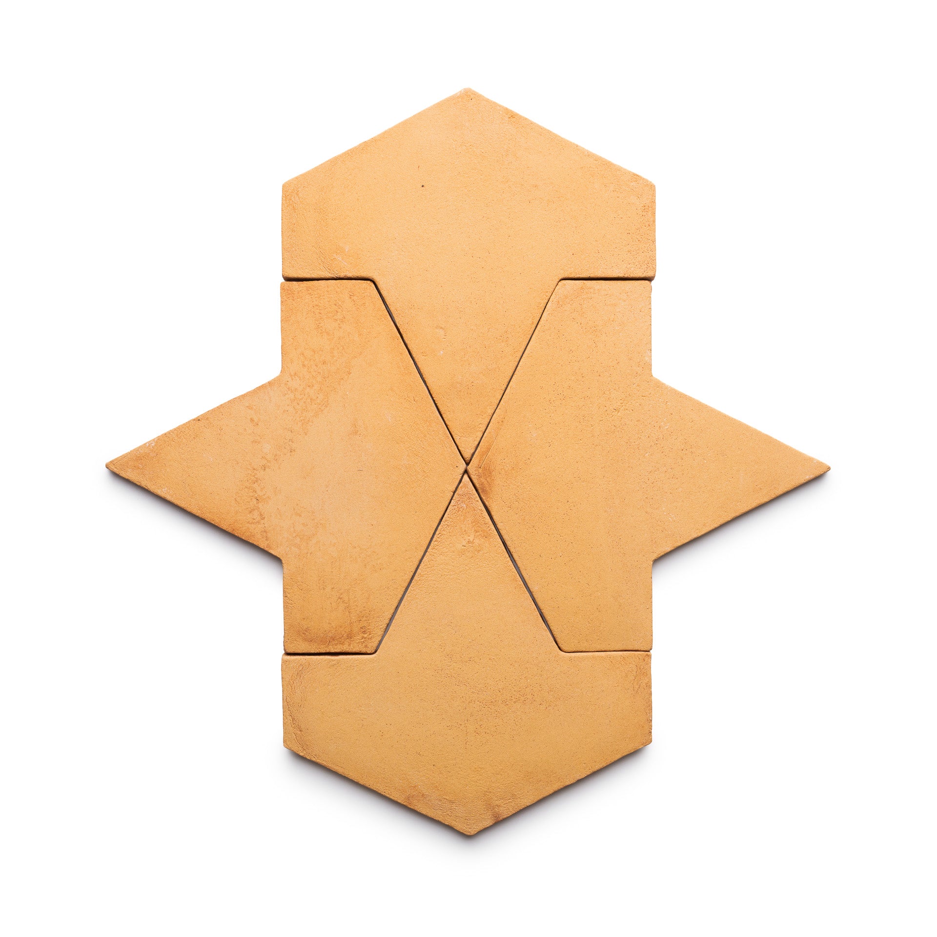 Four Big Alcazar + Adobe tiles by Zia Tile, arranged on a white background to form a symmetrical, stylized arrow or abstract star shape with clean lines and defined edges.