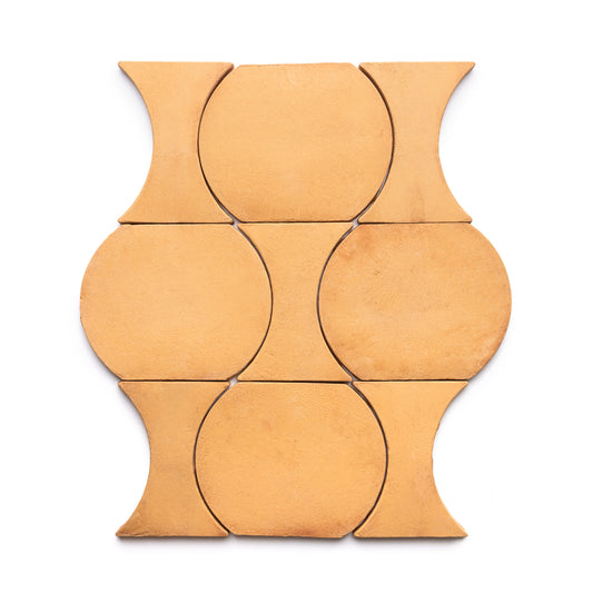 Six tan Oaxaca + Adobe ceramic tiles by Zia Tile are arranged in a geometric pattern with circular and concave sides, forming an interlocking, symmetrical design on a white background.