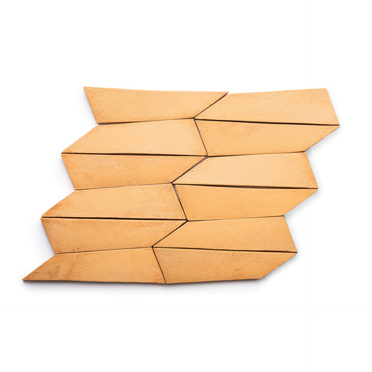 The Tornillo + Adobe tiles by Zia Tile are a set of nine tan, geometric ceramic pieces with angled edges, arranged in an interlocking pattern for a dynamic look on a white background.