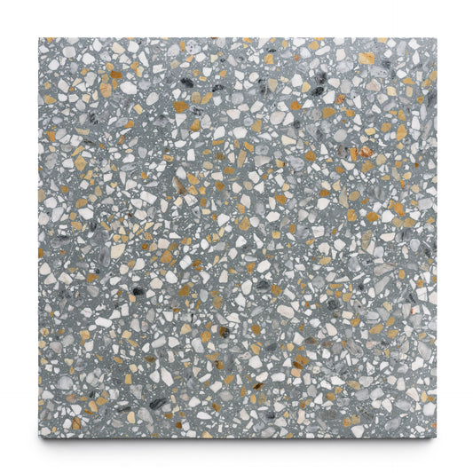 The Andromeda 24x24 by Zia Tile is a square handmade terrazzo tile with a gray base and scattered white, yellow, and black chips, offering a speckled, textured look ideal for adding Zia Tile’s signature charm to any space.