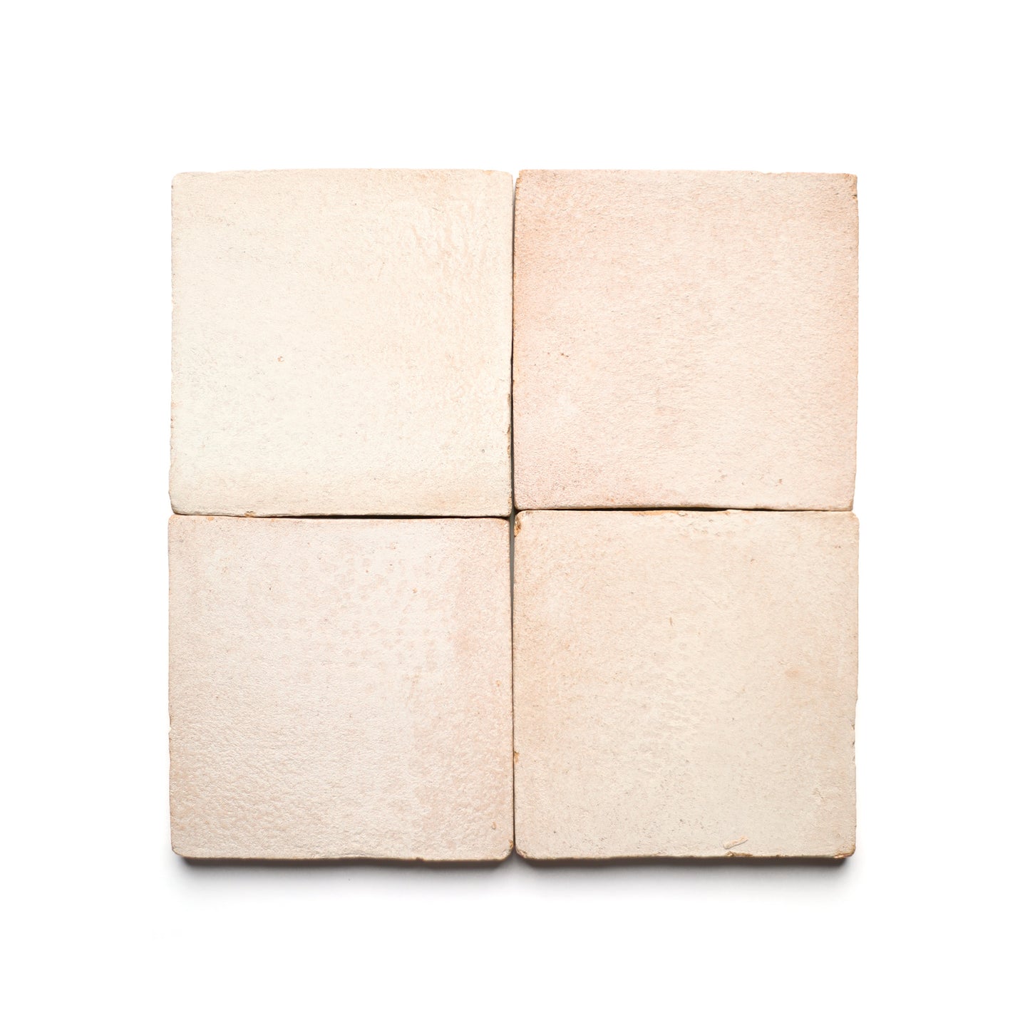 Four 4x4 Square + Blanco tiles from Zia Tile, arranged in a 2x2 grid on a white background. Handmade with a slightly textured matte finish, they highlight the artisanal beauty of ceramic craftsmanship.