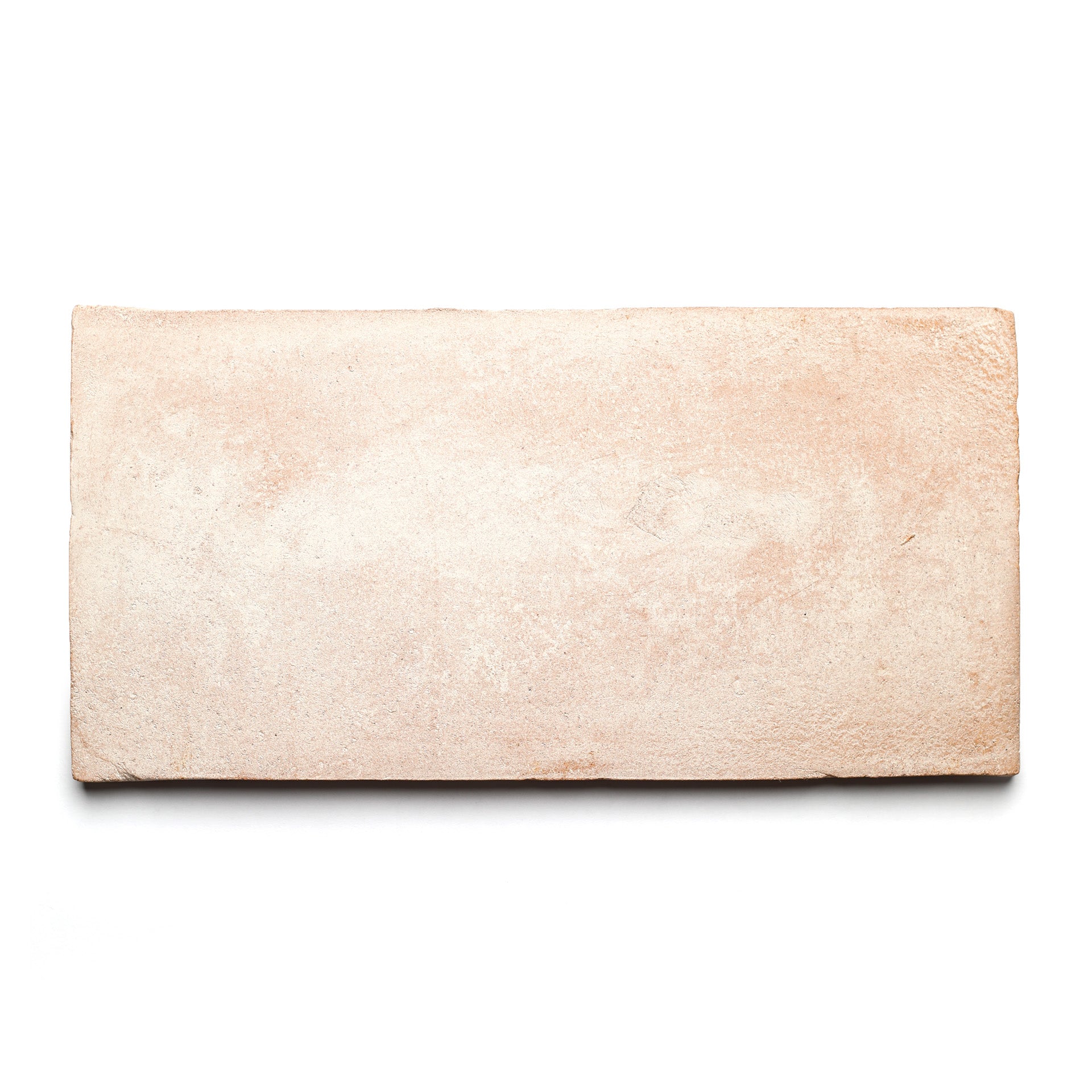 A single 6.5x13 Rectangle + Blanco brick by Zia Tile, handmade with a rough, slightly uneven light brown surface, is shown on a white background.