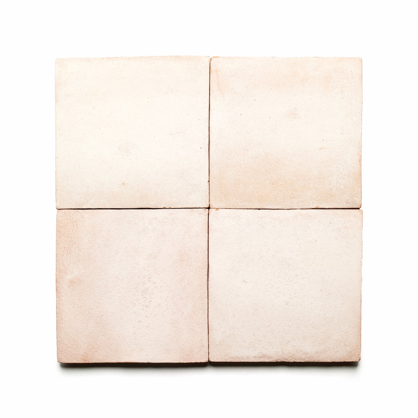 Four 8x8 Square + Blanco ceramic tiles by Zia Tile are displayed in a 2x2 grid on a white background. Their matte finish and handmade, slightly uneven texture add rustic San Miguel de Allende charm.