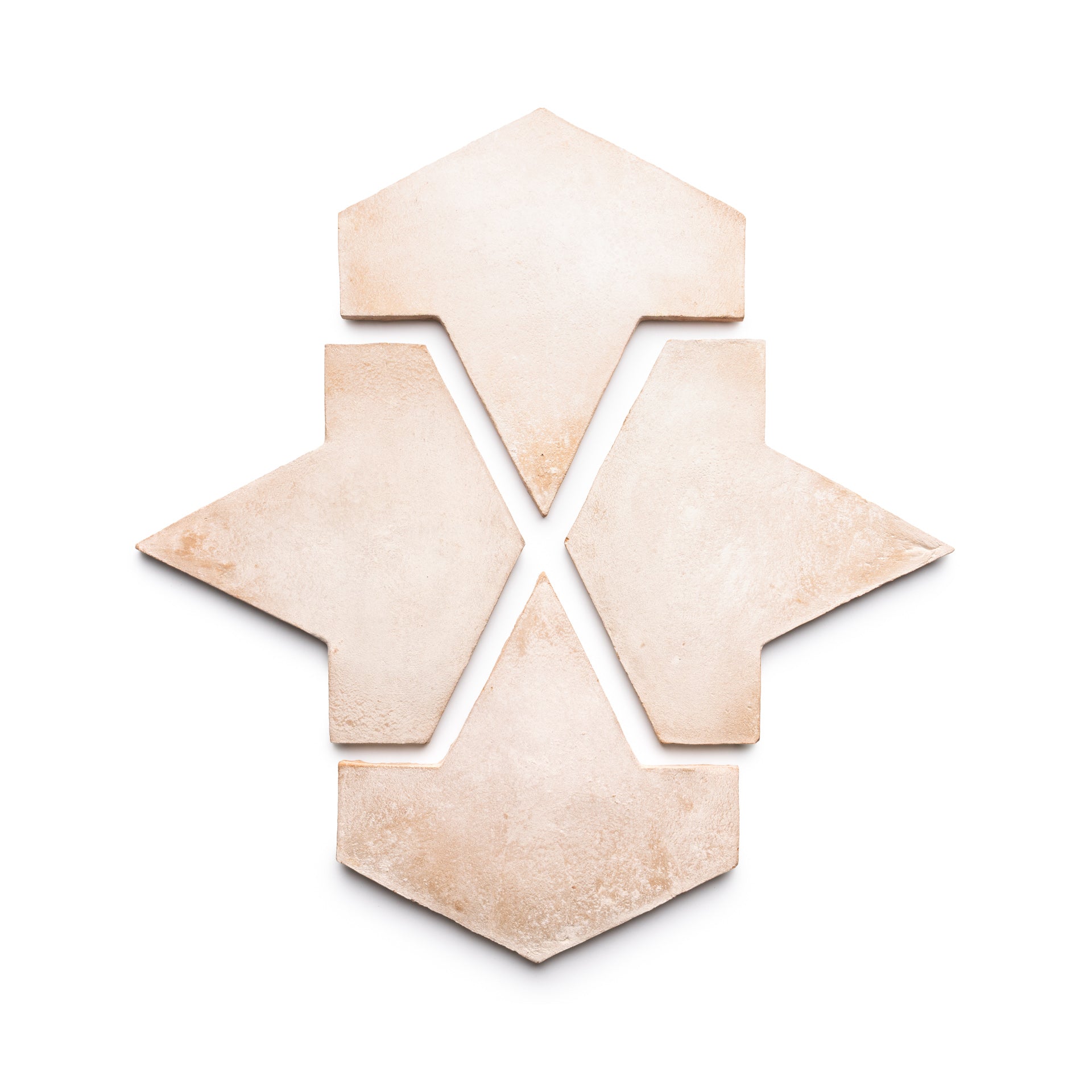 Five Big Alcazar + Blanco beige ceramic tiles by Zia Tile are arranged on a white background, forming a geometric, symmetrical design reminiscent of an arrow or star.