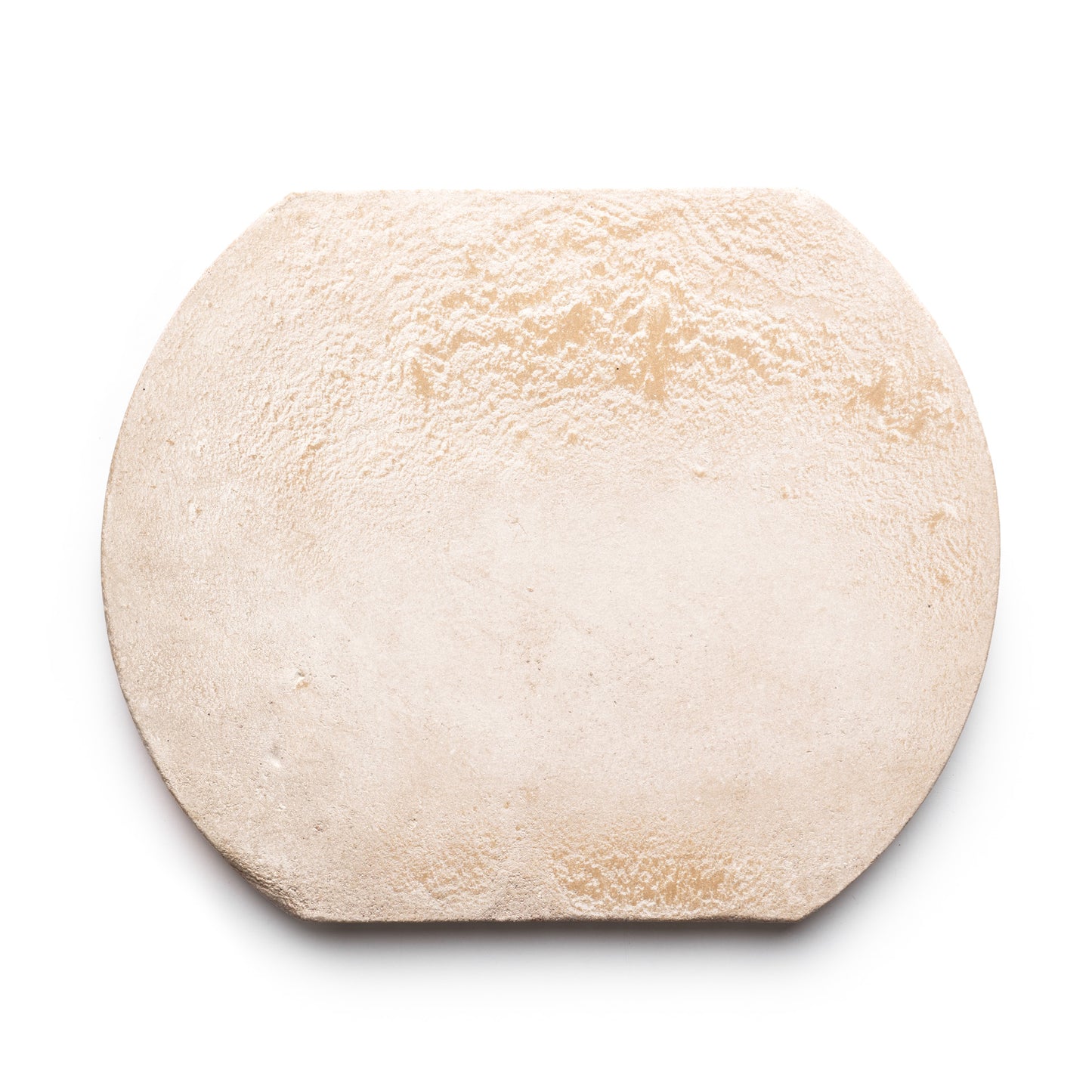 A close-up of Zia Tile’s Oaxaca + Blanco: an oval, lightly textured, uncooked flatbread or pizza dough on a white background.