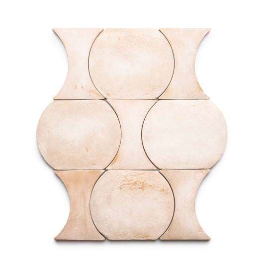 Nine Oaxaca + Blanco tiles by Zia Tile, each circular with concave sides, are arranged in three rows to create a geometric pattern on a white background.