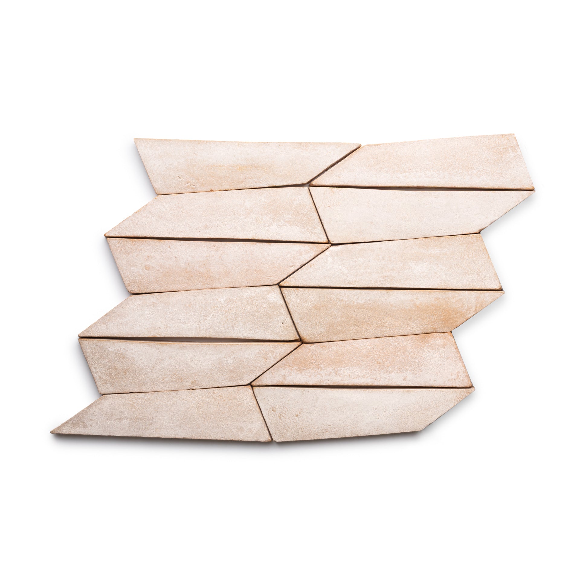 The Tornillo + Blanco ceramic tiles by Zia Tile feature a light beige color and irregular shape, arranged in a staggered geometric pattern on a white background.