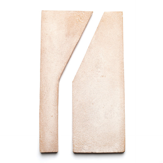 Two beige Zocalo and white Blanco handmade ceramic tiles from Zia Tile, placed side by side with a diagonal cut, create an abstract geometric composition on a white background.