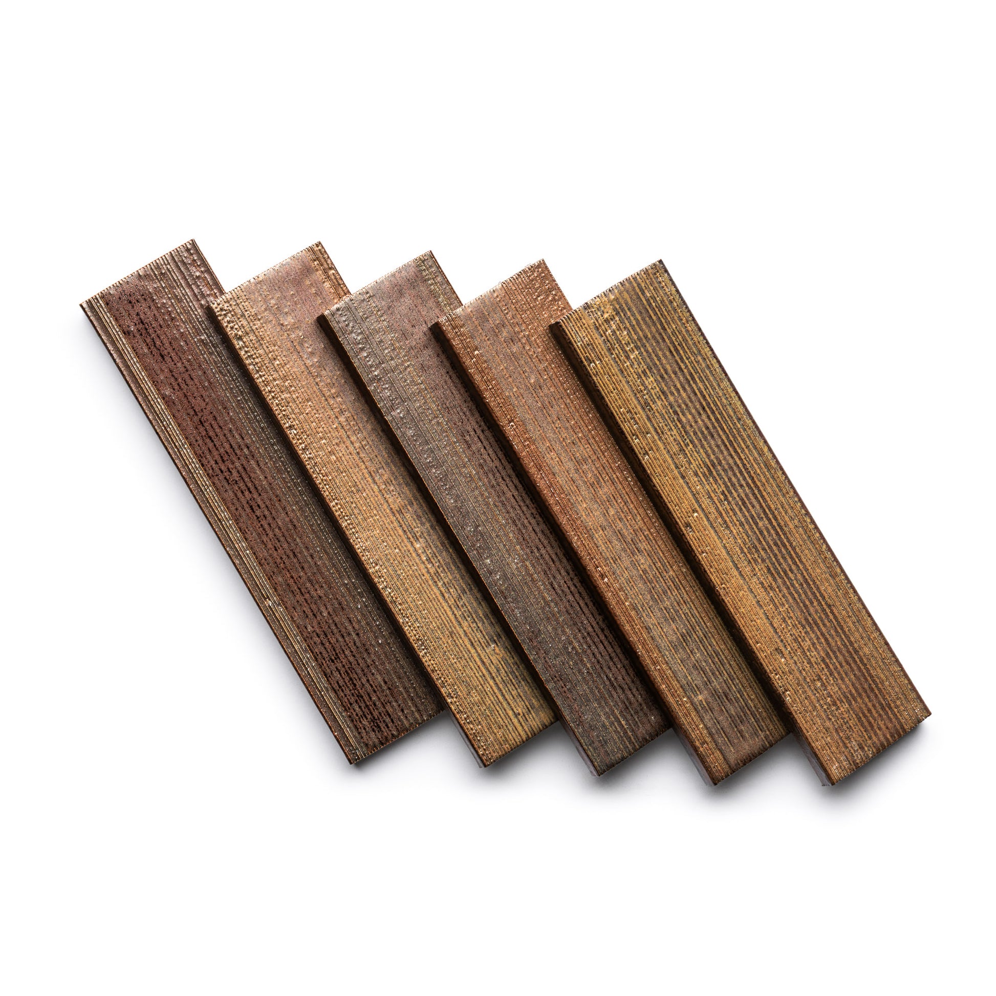 Five Buckeye + Etched tiles by Zia Tile, each rectangular with a textured, weathered wood look, arranged in a slightly fanned pattern on a white background.