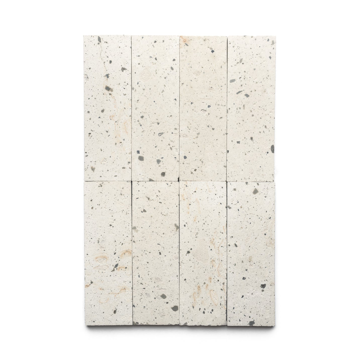 Rectangular arrangement of eight Zia Tile Caldera 4x12 tiles, featuring light-colored speckles with subtle gray and beige hues, set against a plain white background.