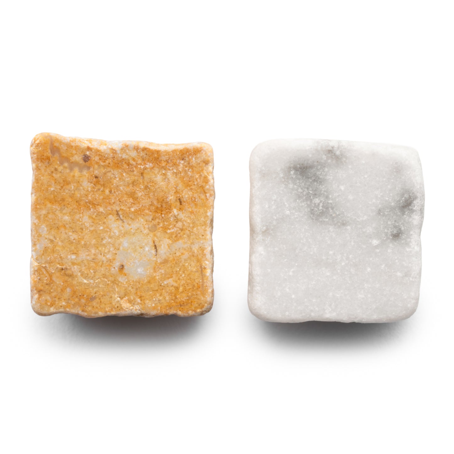 Two square Zia Tile tiles, Check in Carrara + Giallo Reale, are shown side by side on a white background: the left tile is tan with speckles and the right is white with soft gray marbling.