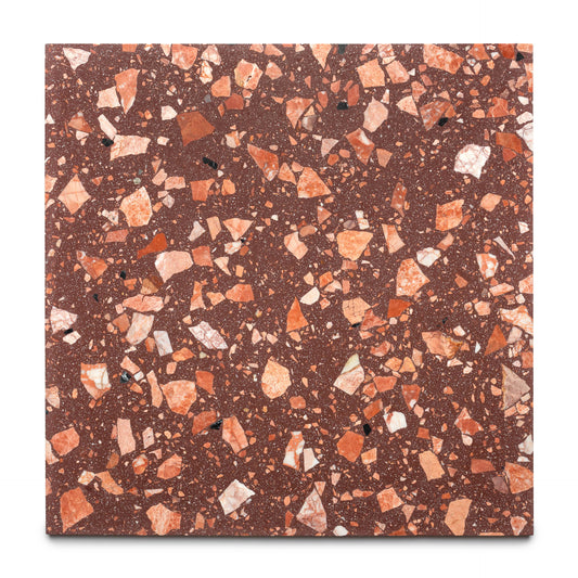 The Date Palm 24x24 by Zia Tile is a square handmade tile with a reddish-brown base and scattered, irregular chips in red, orange, and white tones.