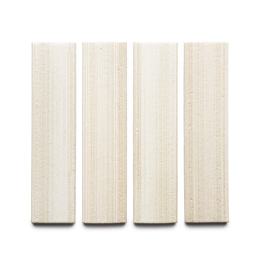 Four rectangular Feather + Etched cream-colored tiles by Zia Tile, featuring a textured grid-like surface, are displayed vertically in a row on a white background.