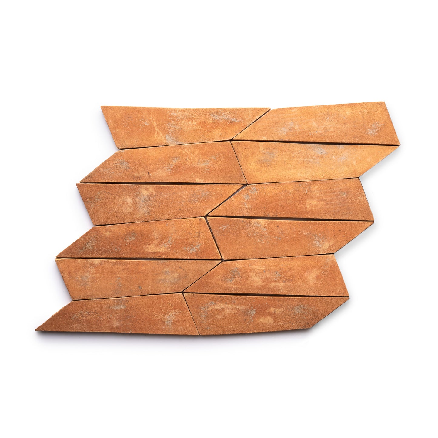 Eight Tornillo + Fired Earth tiles by Zia Tile, featuring an irregular elongated diamond shape and a weathered, rustic finish, are arranged in a staggered, interlocking pattern on a white background.