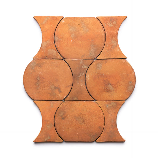Six Oaxaca + Fired Earth terracotta tiles by Zia Tile arranged in a grid. Each features a circular center with outward curves on opposite sides, creating an interlocking pattern against a white background.