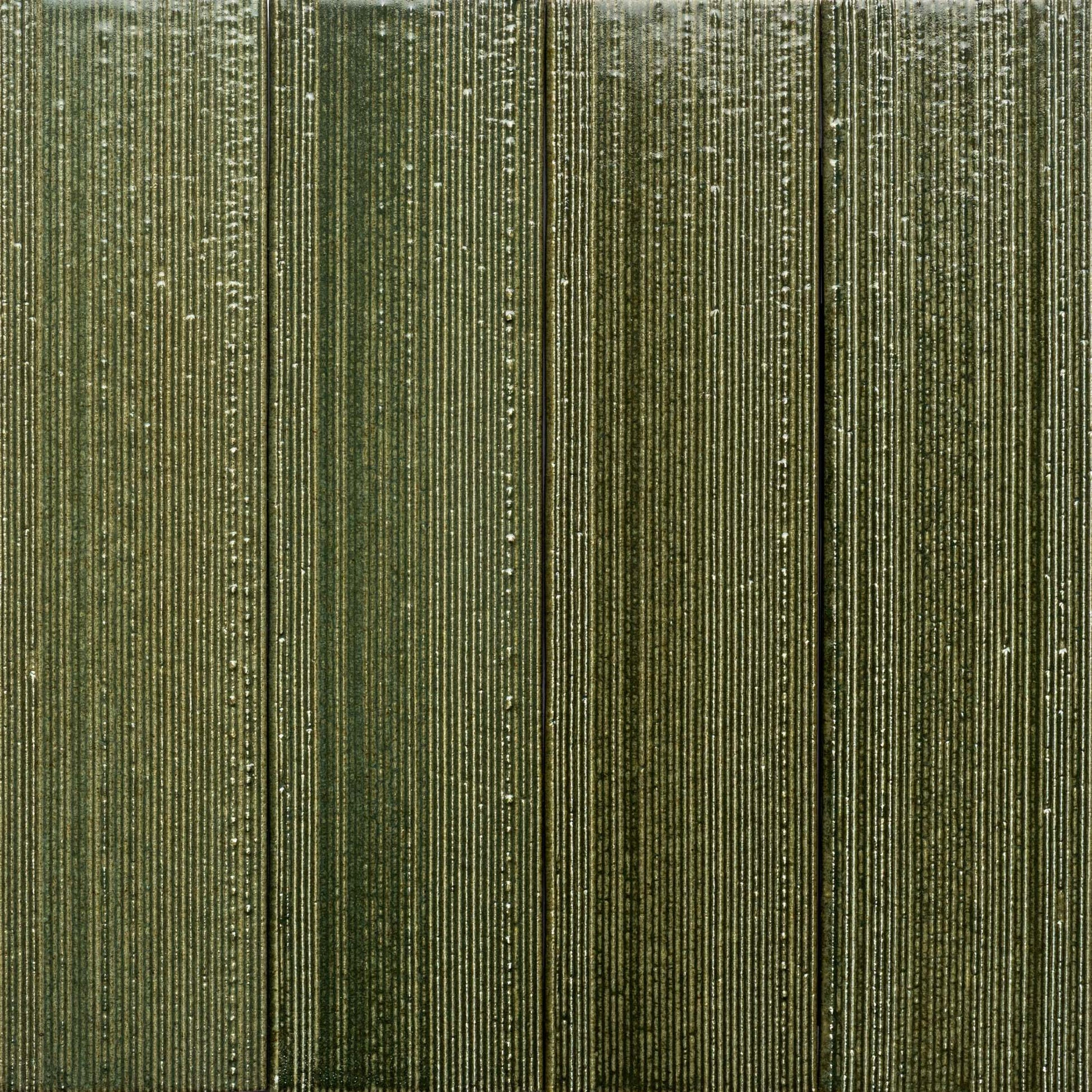 Frogtown + Etched by Zia Tile features a textured surface with vertical ridges in multiple shades of olive green, giving the tile a striped and tactile look.