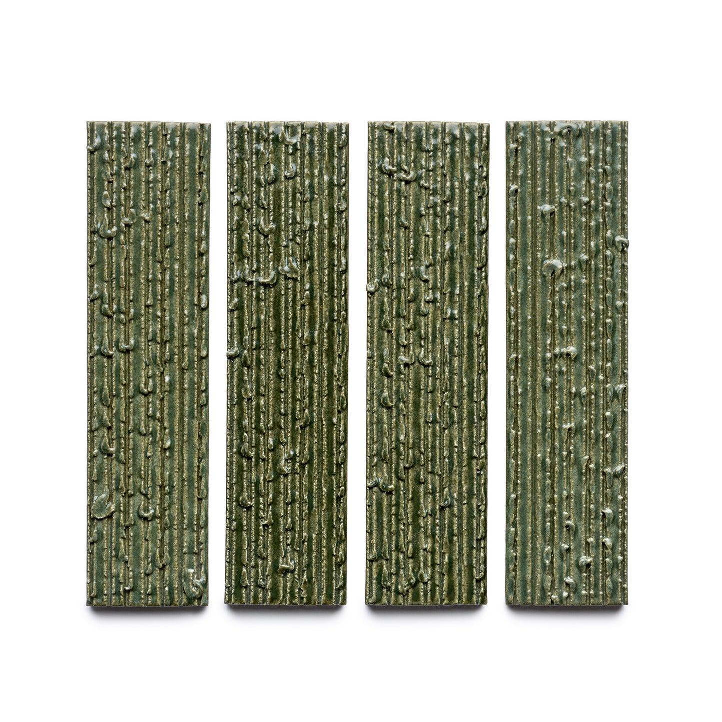 Four rectangular, vertically aligned green tiles from Zia Tile's Frogtown + Furrowed collection, featuring a textured, bark-like surface pattern and evenly spaced on a white background.
