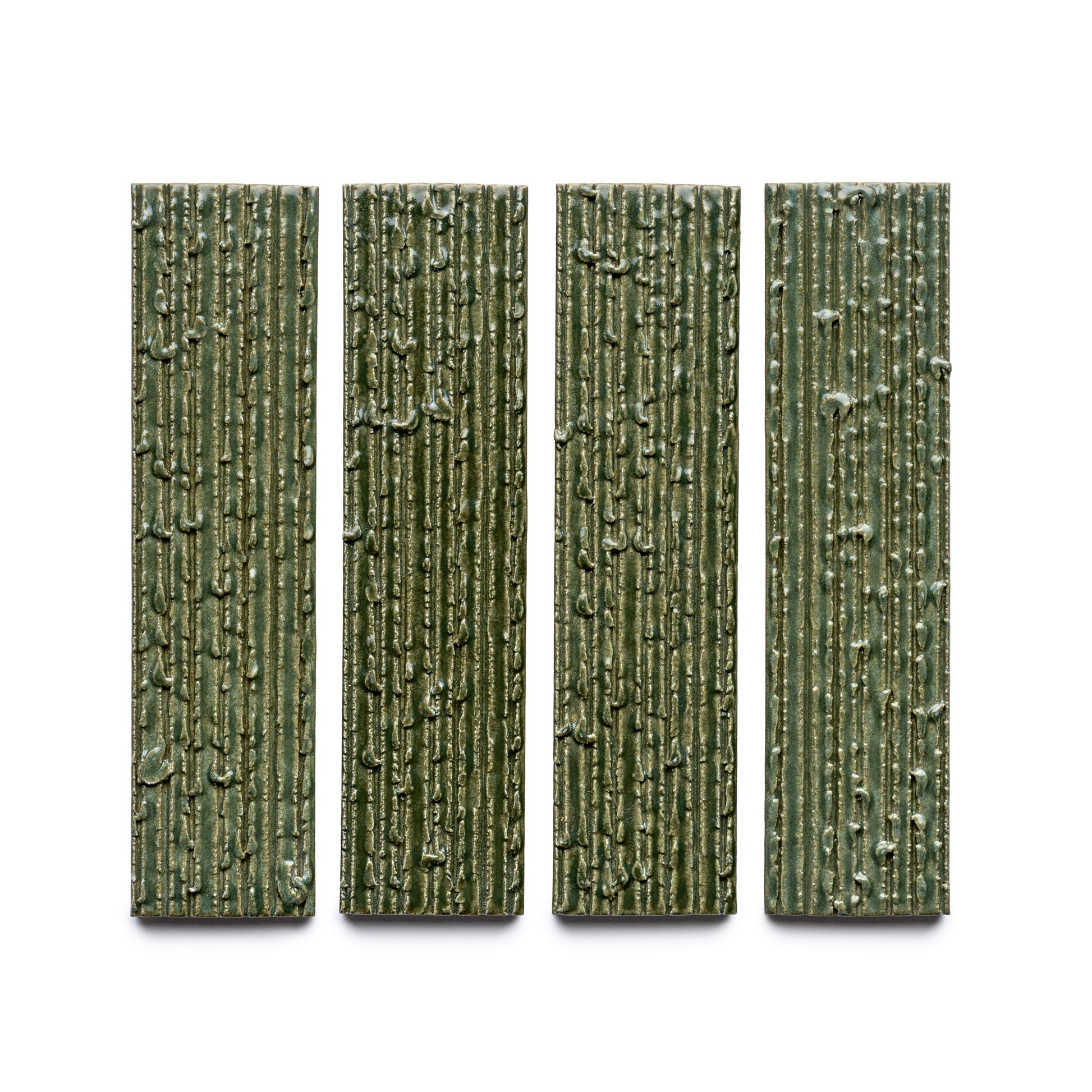 Four rectangular, vertically aligned green tiles from Zia Tile's Frogtown + Furrowed collection, featuring a textured, bark-like surface pattern and evenly spaced on a white background.