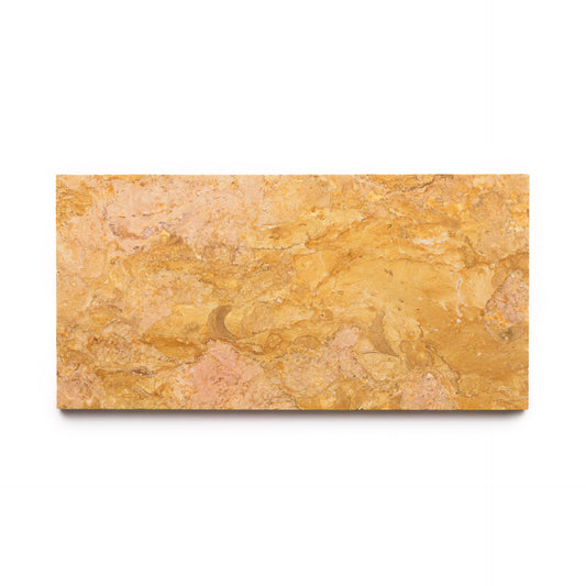 The Giallo Reale 6x12 by Zia Tile is a rectangular golden-yellow marble slab with subtle pink and beige veining, showcasing artisanal charm against a white background.