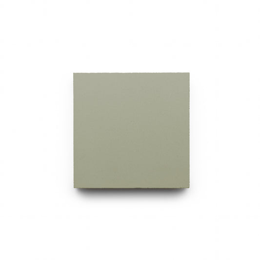 The Gypsum 4x4 handmade tile by Zia Tile, featuring a plain light gray finish, is centered on a white background.