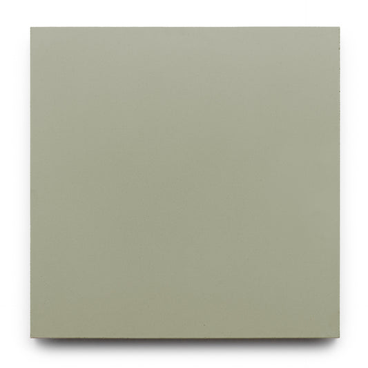The Zia Tile Gypsum 8x8 features a smooth, uniform light grayish-green finish, evoking the look of handmade tile, in a square shape with no visible patterns or details, set against a plain white background.