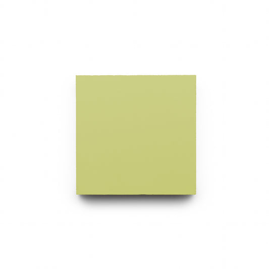 A single square yellow-green sticky note is centered on a plain white background, echoing the fresh tones of Zia Tile’s Lemongrass 4x4 handmade tiles.