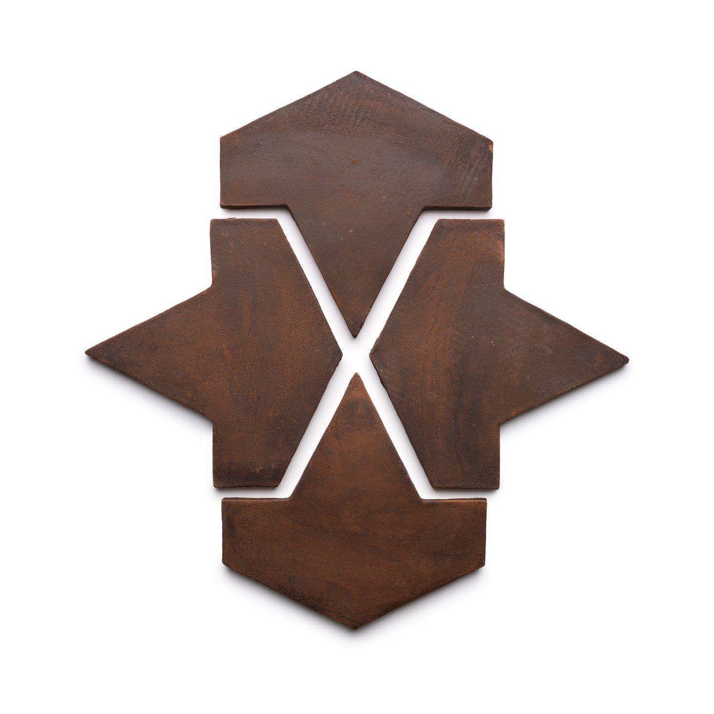 Four Big Alcazar + Madera ceramic tiles by Zia Tile are arranged on a white background, forming a symmetrical geometric pattern with arrow and diamond shapes pointing outward from the center.