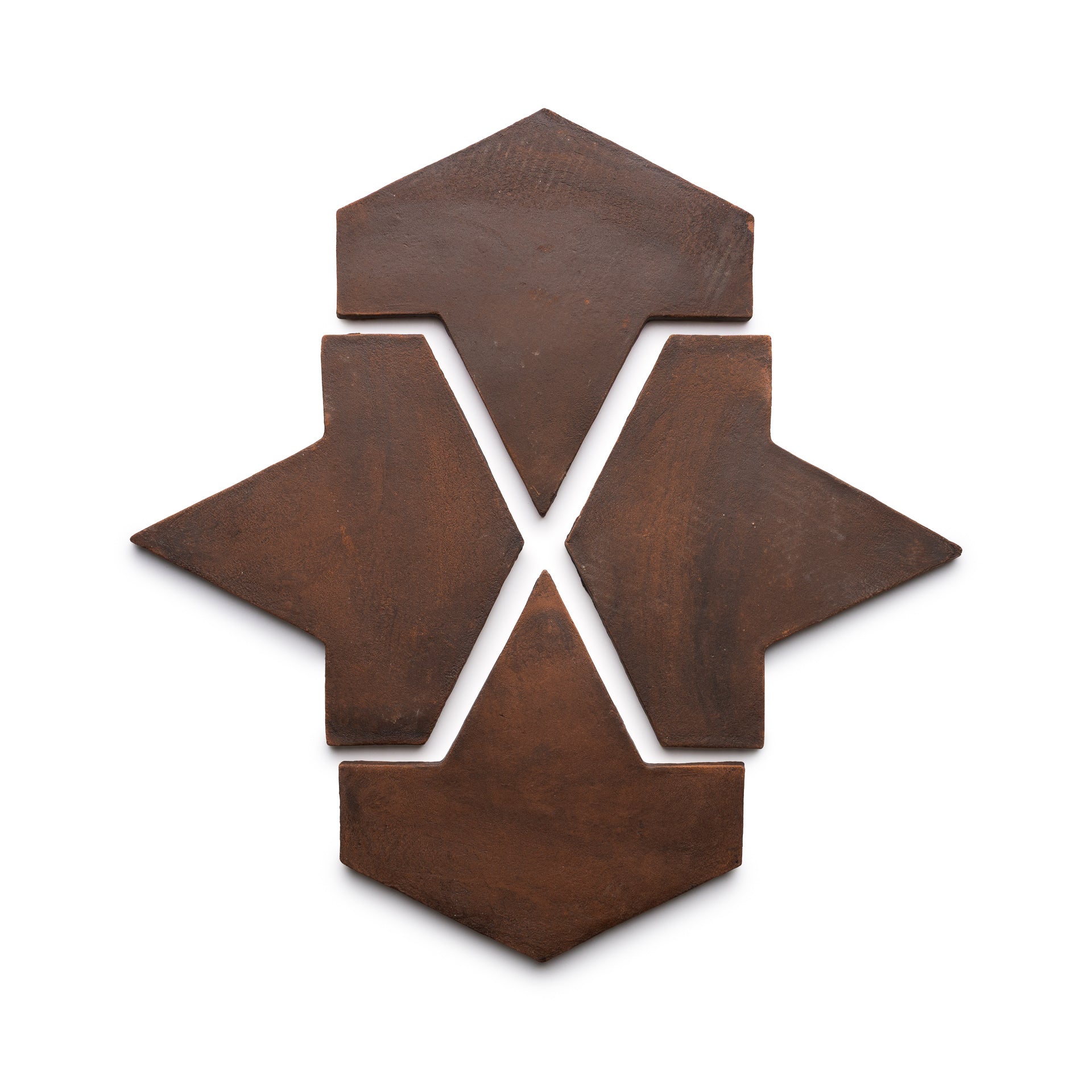 Four Big Alcazar + Madera ceramic tiles by Zia Tile are arranged on a white background, forming a symmetrical geometric pattern with arrow and diamond shapes pointing outward from the center.