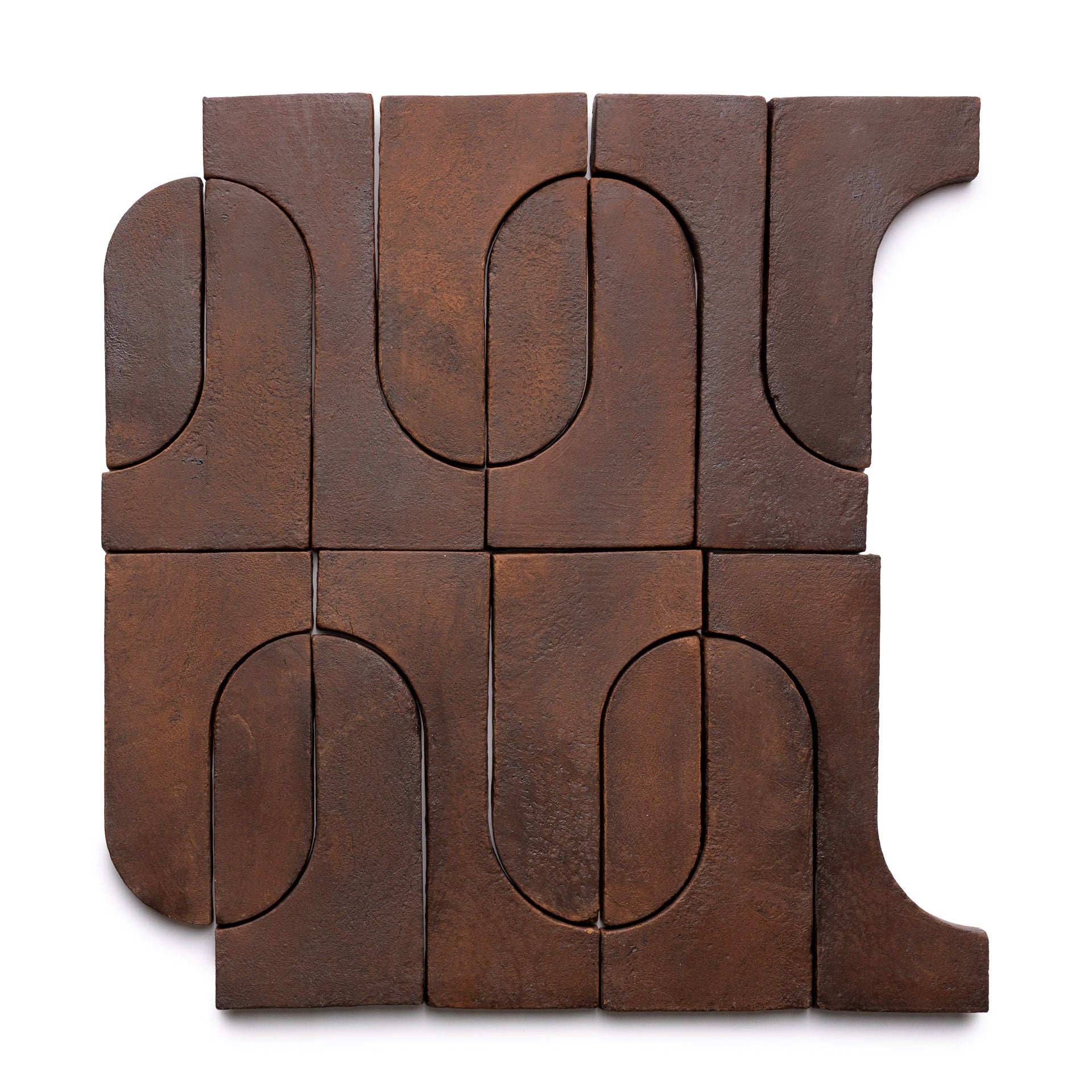 Nine brown Durango + Madera wooden blocks by Zia Tile form a square. Featuring curved and straight cutouts, they create an abstract, interlocking pattern with a modern, minimalist look.