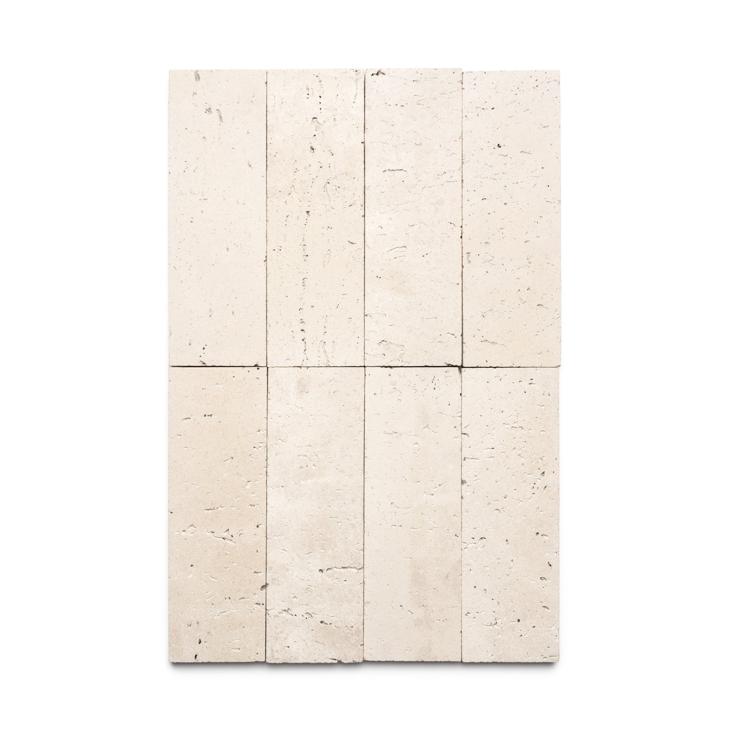 Eight Mesa 4x12 tiles by Zia Tile are arranged in two rows of four on a white background. These beige tiles feature a natural, slightly rough texture with subtle pits and color variations typical of Mexican Cantera.
