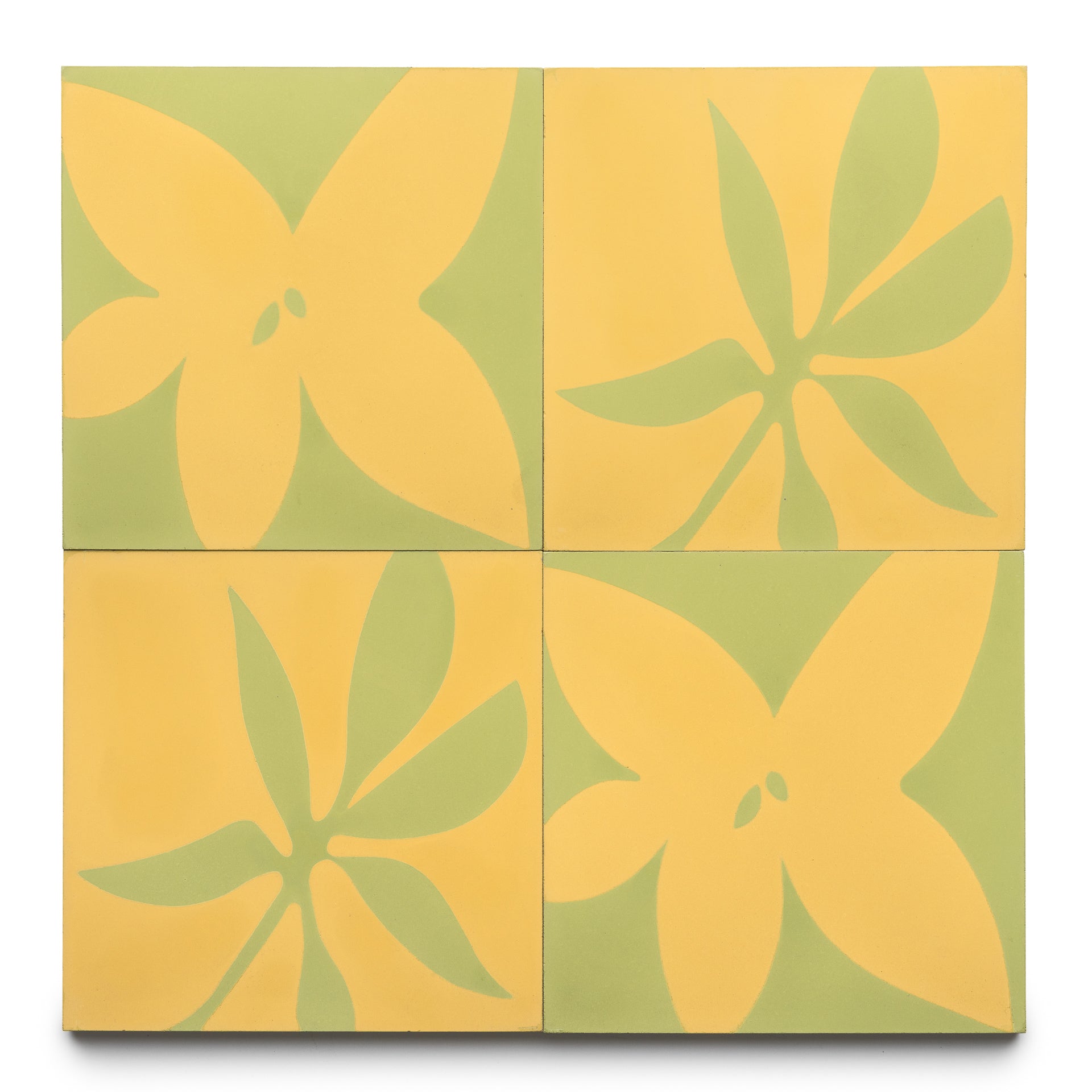 Four Flora 8x8 Set Mustard + Lemongrass tiles by Zia Tile form a rectangular grid, with yellow and green abstract floral designs that combine into a larger symmetrical flower pattern.
