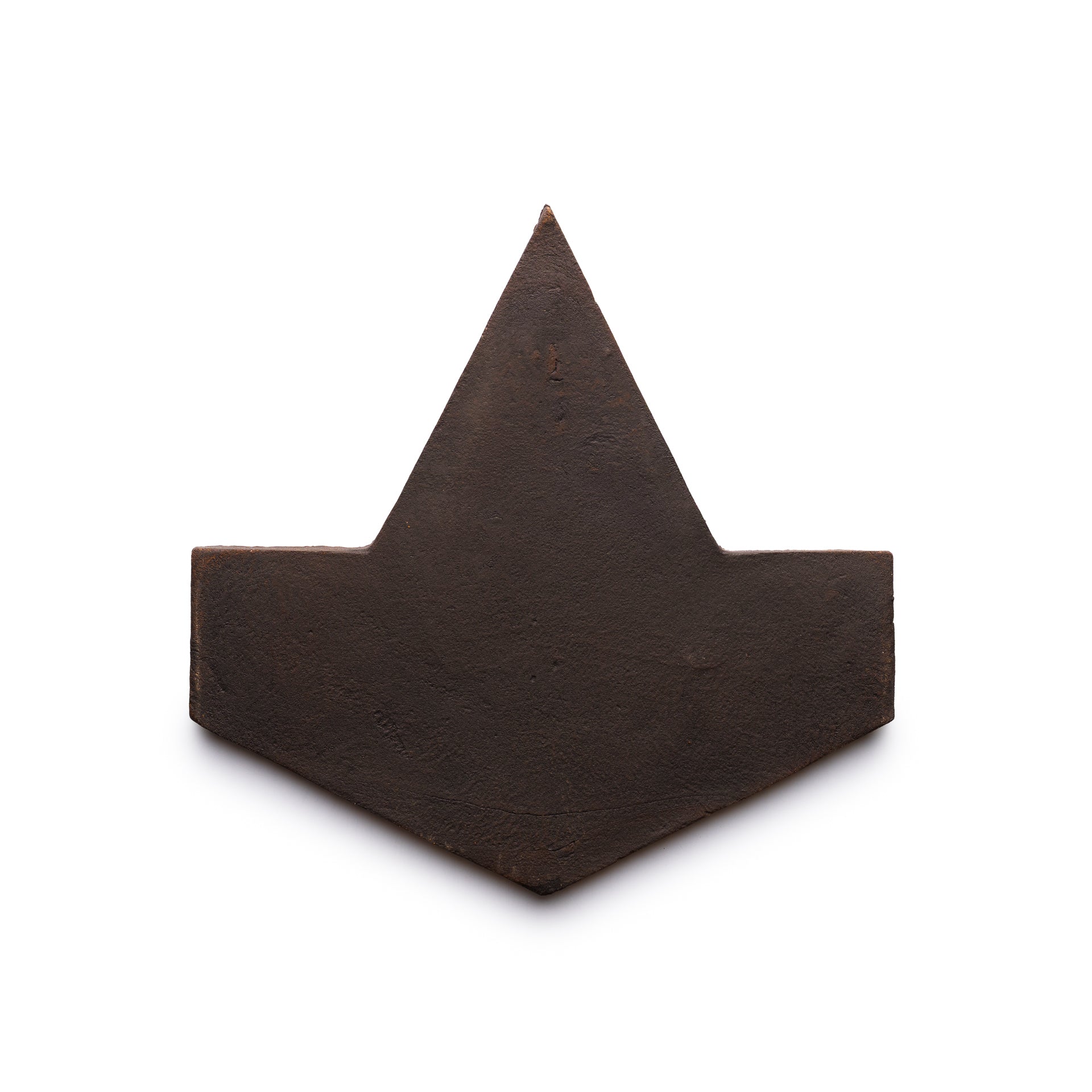 The Big Alcazar + Oscura sample by Zia Tile is a flat, dark brown geometric tile shaped like an angular arrow or paper boat, shown on a white background.