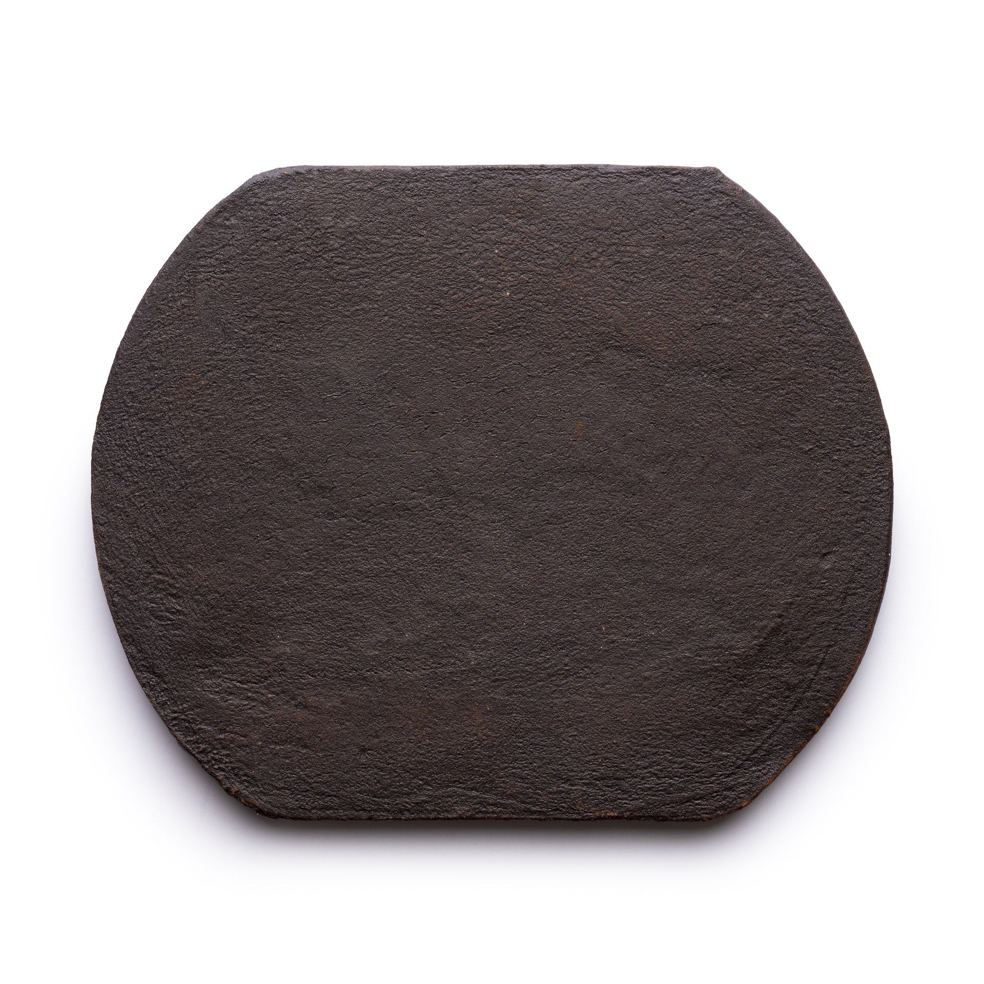 The Oaxaca + Oscura by Zia Tile is a flat, dark brown, roughly octagonal stone slab with a textured surface, shown against a white background.