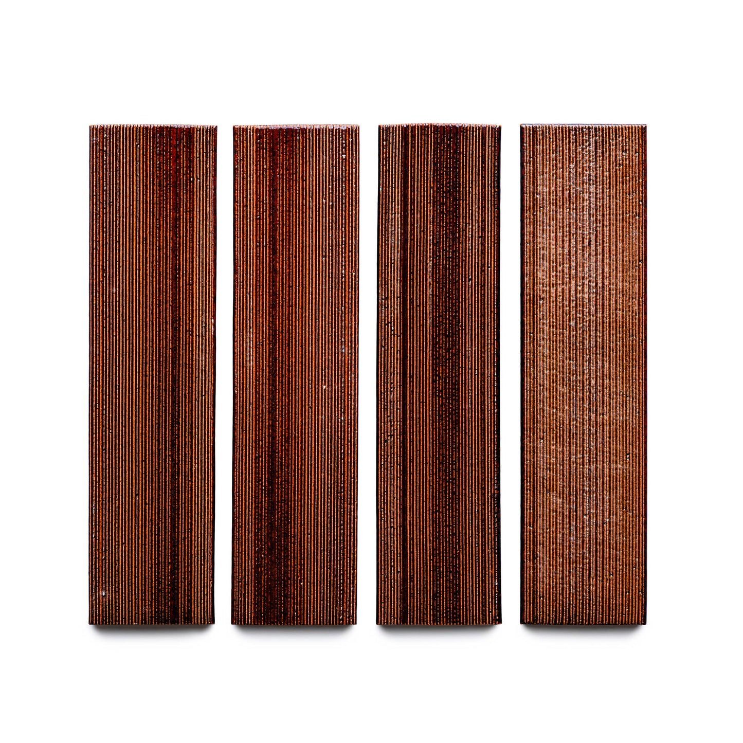 Four Oxblood + Etched rectangular wood tiles from Zia Tile, featuring vertical grain patterns, arranged side by side on a white background.