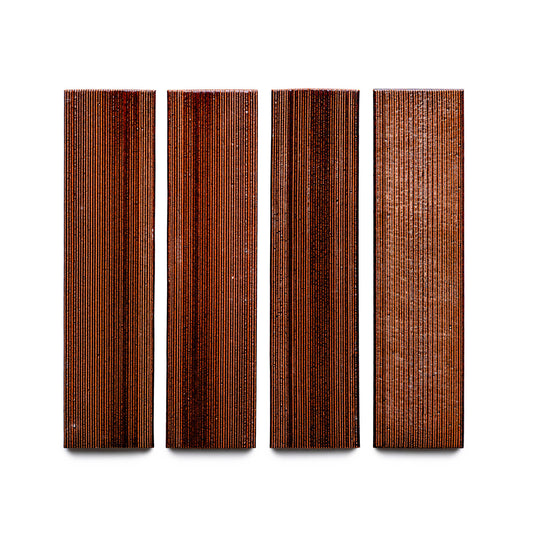 Four Oxblood + Etched rectangular wood tiles from Zia Tile, featuring vertical grain patterns, arranged side by side on a white background.