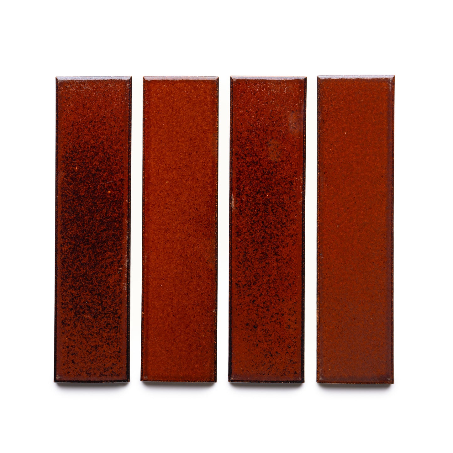 Four Oxblood + Flat rectangular glossy tiles by Zia Tile, in a rich reddish-brown hue, are arranged vertically in a row against a white background.