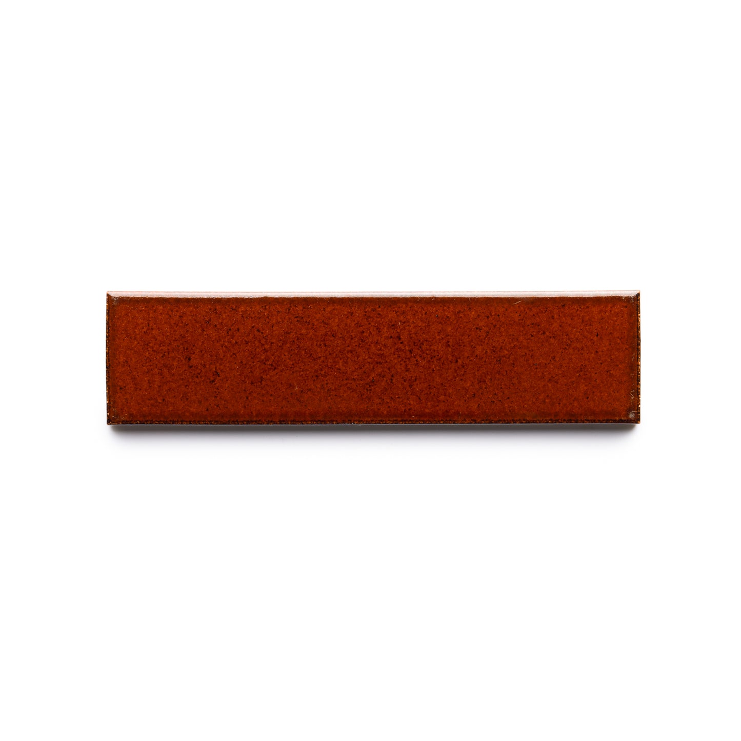 The Oxblood + Flat from Zia Tile is a rectangular, glossy, reddish-brown ceramic tile shown against a white background.
