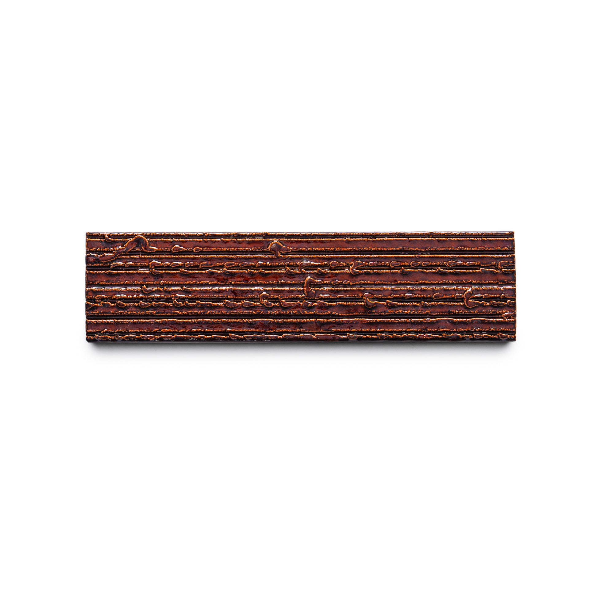Oxblood + Furrowed by Zia Tile: A rectangular tile with horizontal grooves and textured lines, resembling tree bark, displayed on a white background.