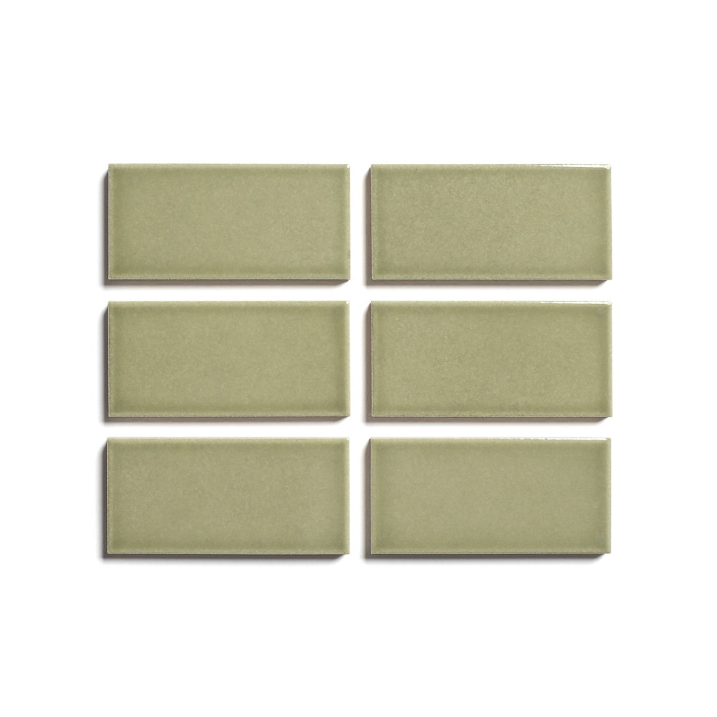 Six Ponderosa 2x4 ceramic tiles by Zia Tile, architectural grade and light olive green, are arranged in two rows of three on a white background.