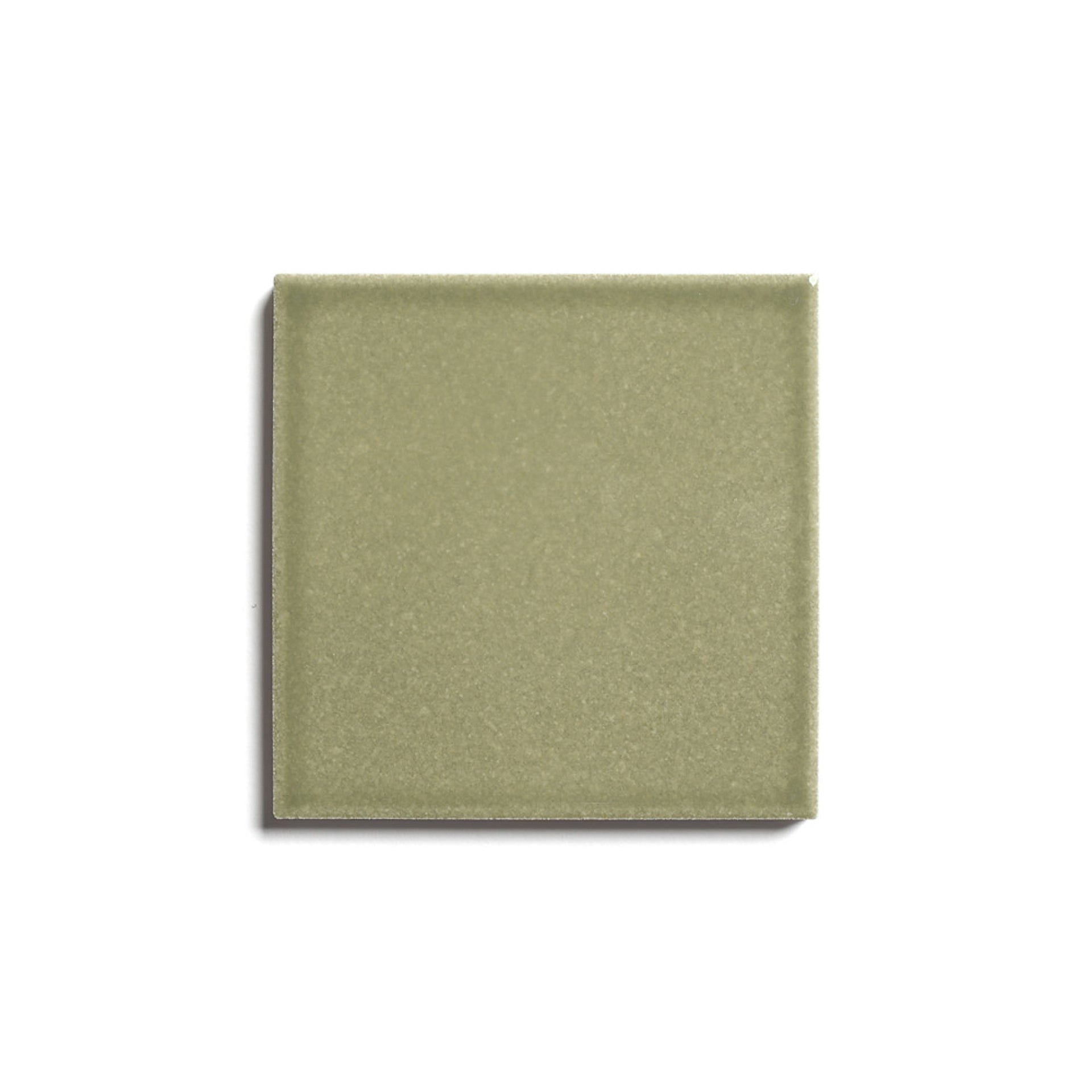 The Ponderosa 4x4 ceramic tile by Zia Tile, a square matte olive green tile, is centered on a white background with a faint shadow to the left.