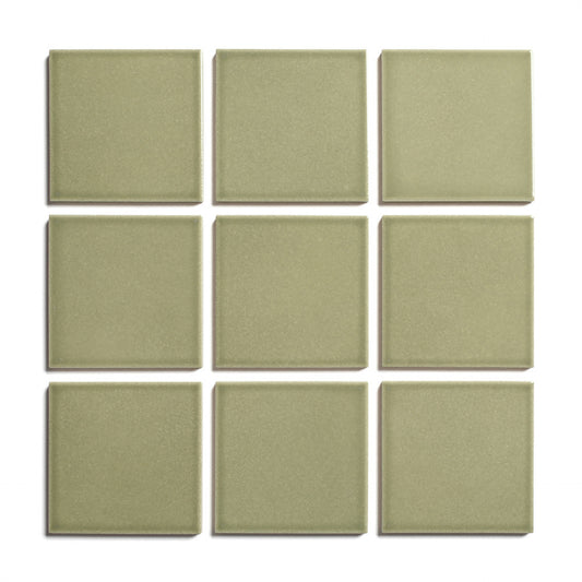 Nine Ponderosa 4x4 ceramic tiles by Zia Tile, featuring an olive green glossy finish, are arranged in a 3x3 grid on a white background.