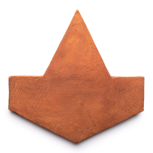 The Big Alcazar + Red Clay by Zia Tile is a flat, geometric terracotta tile in a reddish-brown hue, shaped like an upward-pointing arrow and shown on a white background.
