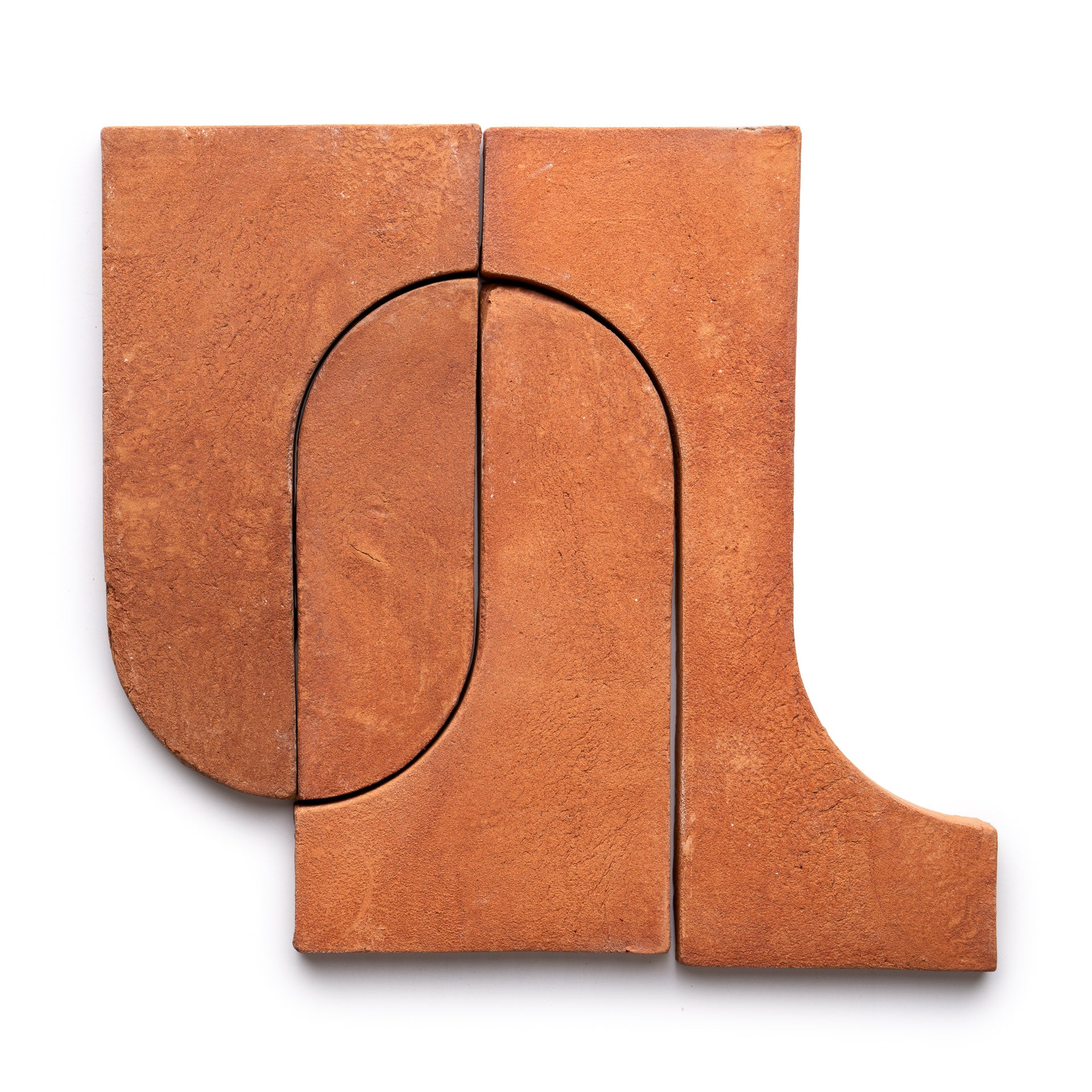 Three Durango + Red Clay tiles by Zia Tile arranged in a geometric, abstract pattern with curved and straight edges, forming an arch-like shape on a white background.