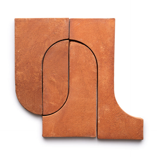 Three Durango + Red Clay tiles by Zia Tile arranged in a geometric, abstract pattern with curved and straight edges, forming an arch-like shape on a white background.