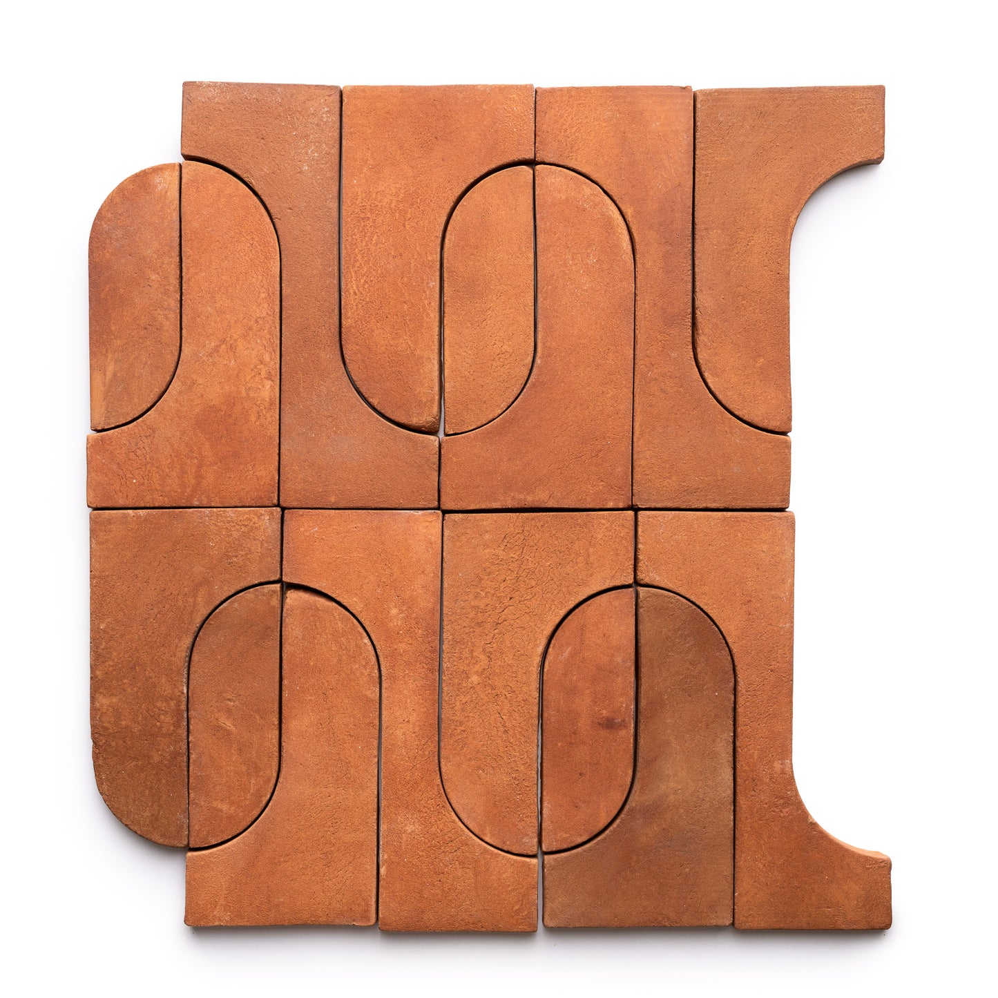 Nine Durango + Red Clay tiles by Zia Tile, arranged in a square grid, feature curved and straight cutouts forming an abstract geometric pattern on a white background.